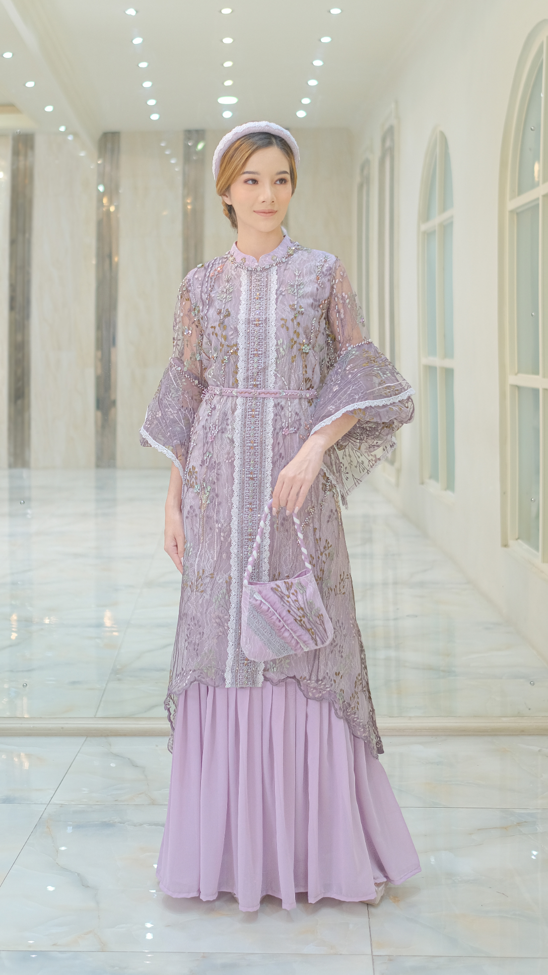 https://rtw.ivorystudio.id/wp-content/uploads/2023/08/Lilac-Dress-with-Asymmetrical-Layers-on-Puff-Sleeves-1.webp